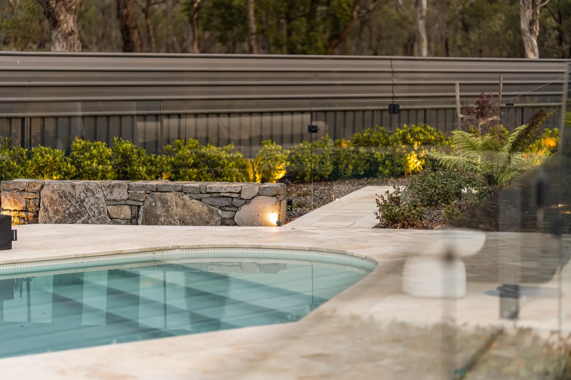 Garden and pool lighting at dusk at the Hackett new build